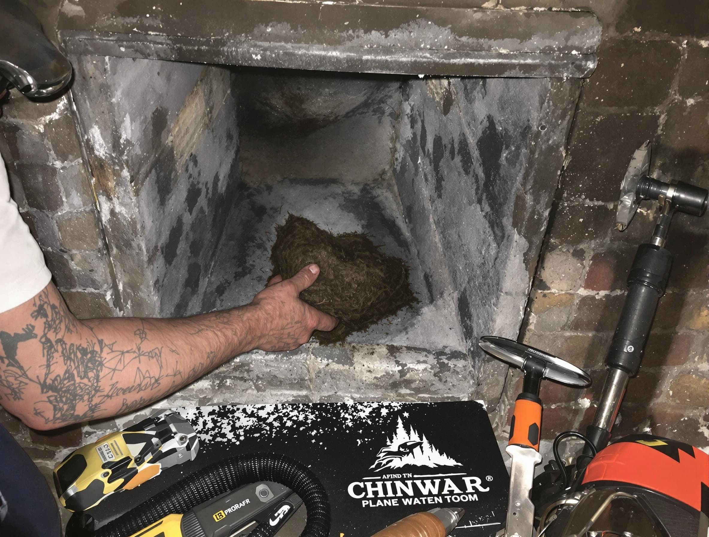 Middleborough Chimney Sweep safely removing debris and screening chimney in Middleborough, MA
